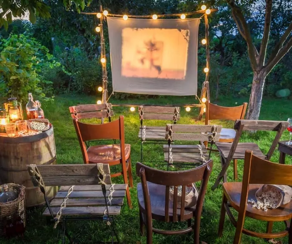 Outdoor movie night with a screen and chairs