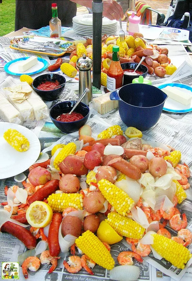 A pot of Cajun Seafood Boil with corn, potatoes, shrimp, and onions.