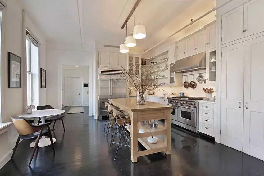 Modern kitchen with satin nickel 7 light chandelier and Mazama hardwood flooring