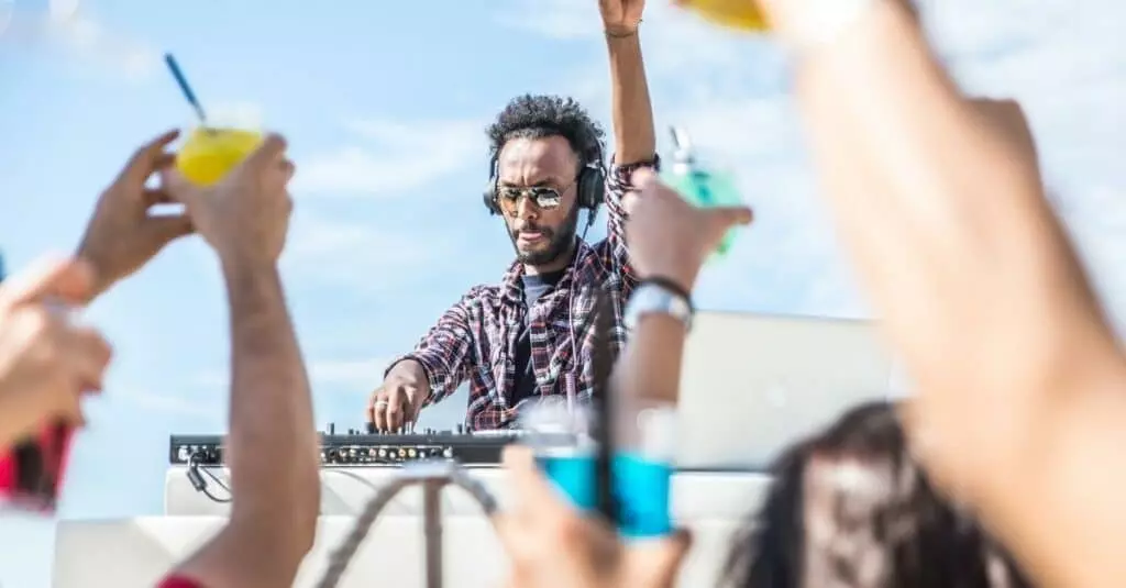 picture of a DJ at a beach party