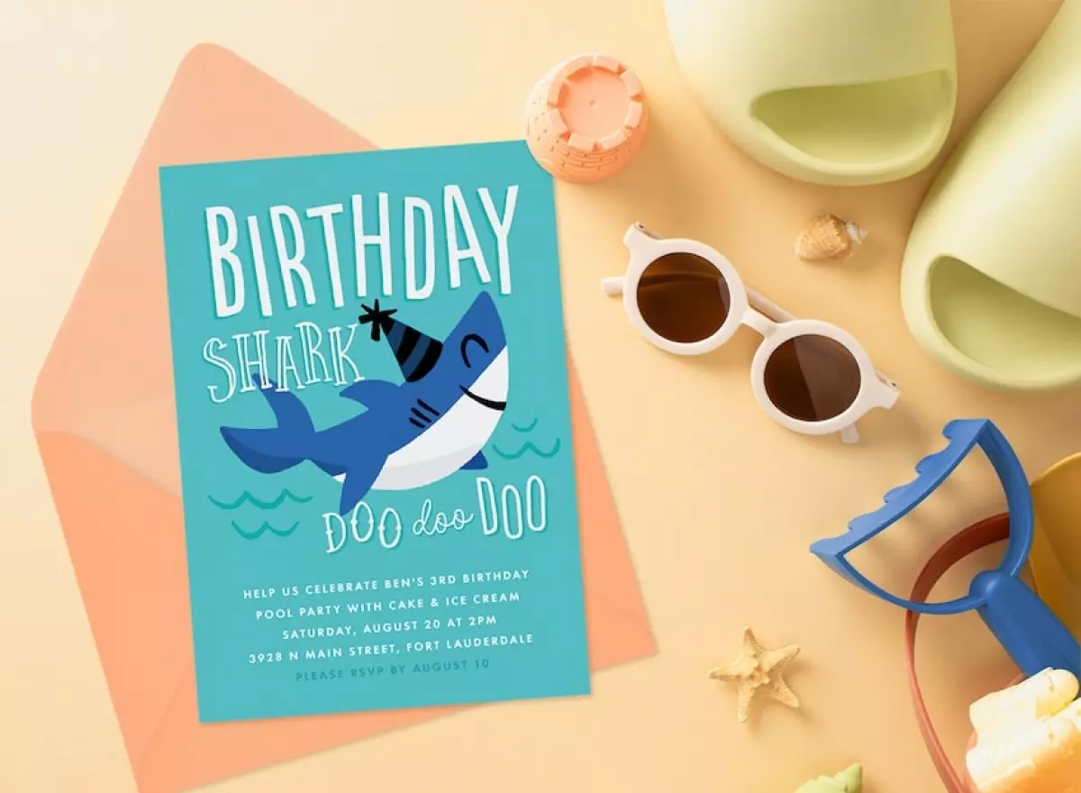Shark birthday party: Birthday Shark Invitation, a pair of sunglasses, and some shells