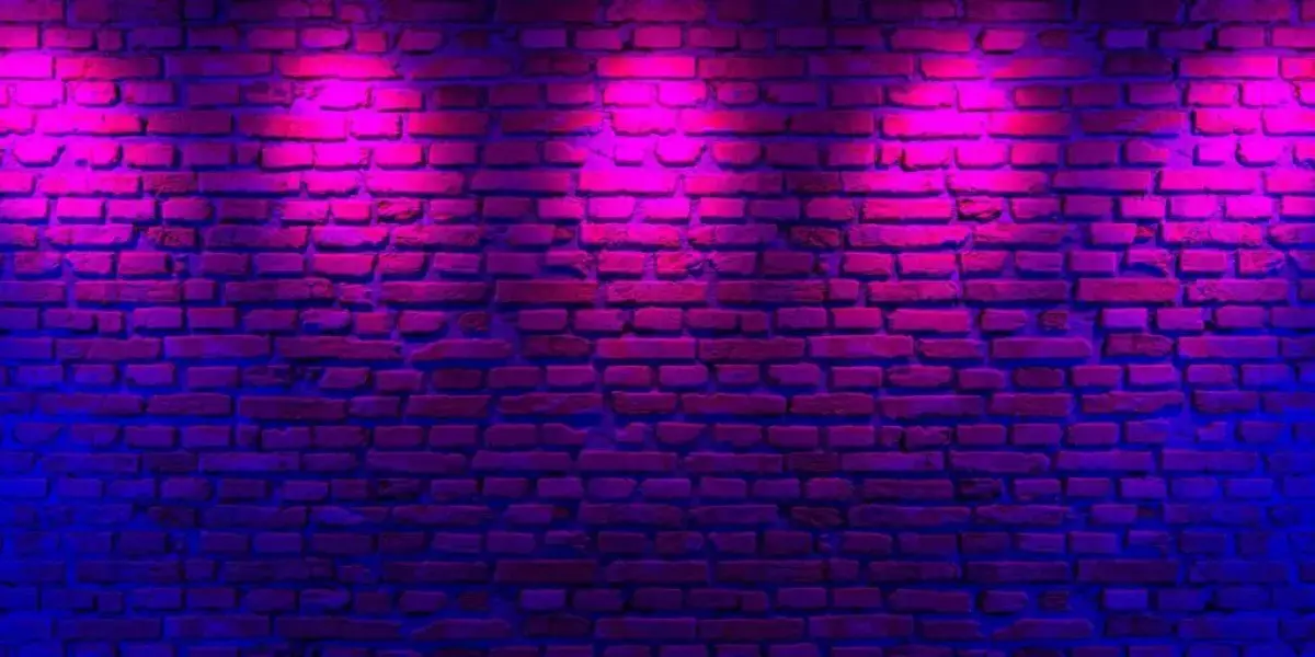 Wide shot of a wall decorated with neon lights for a glow party
