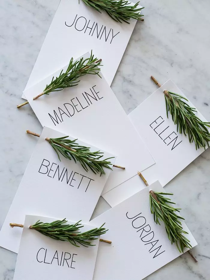 name cards with rosemary sprigs